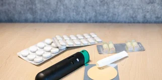 Nicotine replacement therapy products laid out on a desk