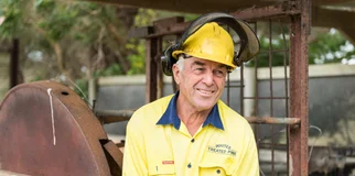 Welder smiles off camera photo