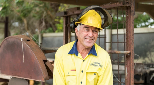 Welder smiles off camera photo