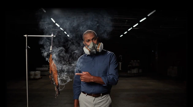 Man showing toxic smoke from tobacco