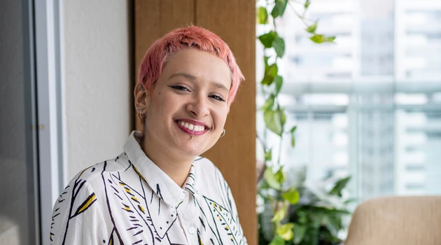 Woman pink hair smiling